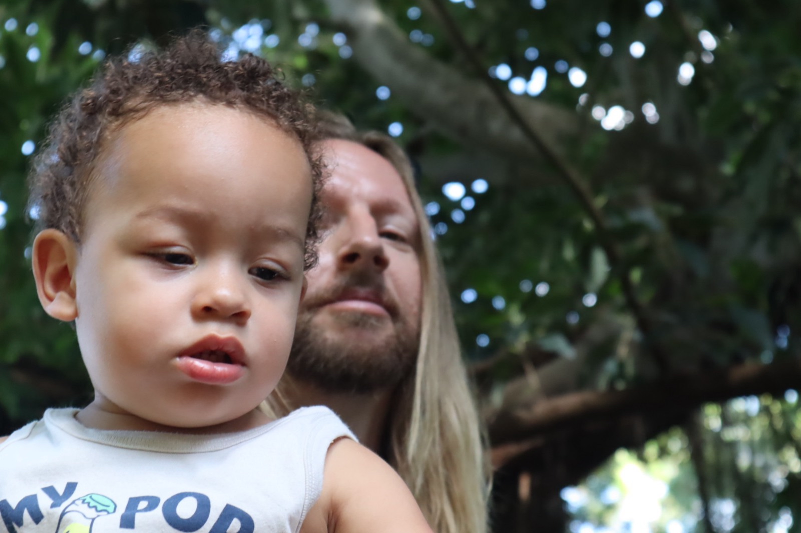 Tampa outdoor family portrait of a toddler with a parent among the trees